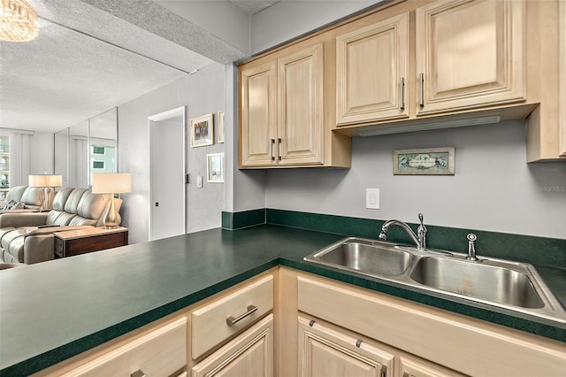 2987 S Atlantic Ave Unit 901, Daytona Beach, FL 32118 - kitchen featuring light brown cabinetry, open floor plan, a textured ceiling, and dark countertops