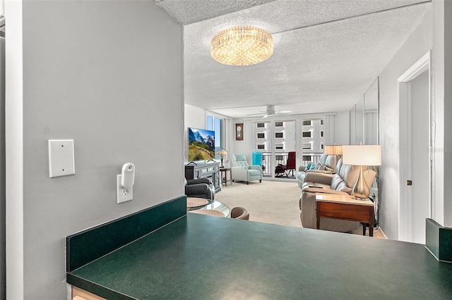 2987 S Atlantic Ave Unit 901, Daytona Beach, FL 32118 - dining area featuring a textured ceiling, ceiling fan, carpet, and a chandelier
