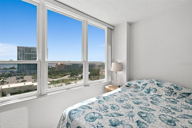 2987 S Atlantic Ave Unit 901, Daytona Beach, FL 32118 - bedroom with a textured ceiling and a view of city