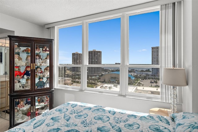 2987 S Atlantic Ave Unit 901, Daytona Beach, FL 32118 - bedroom featuring a city view and a textured ceiling
