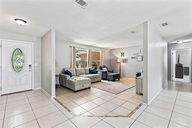 833 Lucerne Cir, Ormond Beach, FL 32174 - foyer with light tile patterned flooring and a textured ceiling