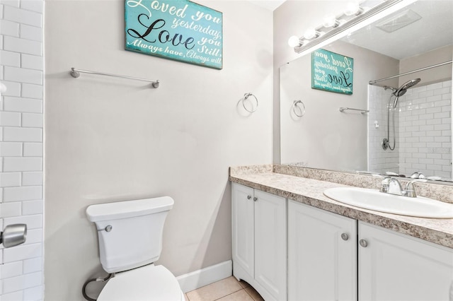 833 Lucerne Cir, Ormond Beach, FL 32174 - bathroom featuring vanity, toilet, a tile shower, and tile patterned floors