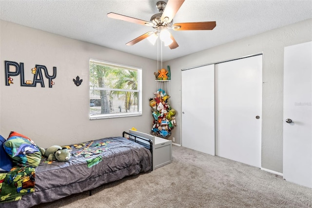 833 Lucerne Cir, Ormond Beach, FL 32174 - carpeted bedroom with a closet, ceiling fan, and a textured ceiling