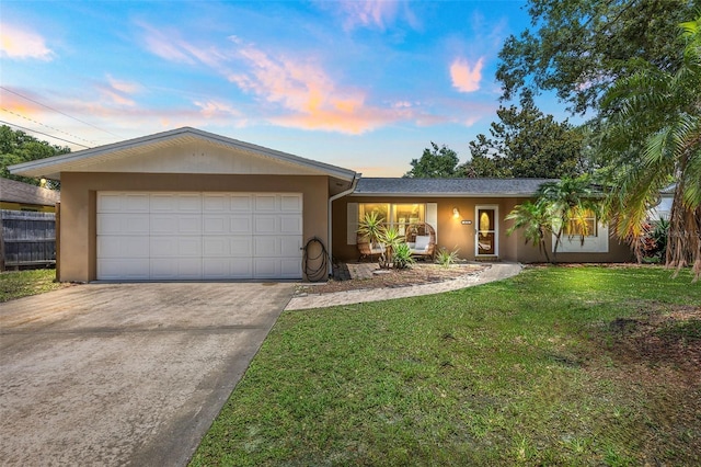 833 Lucerne Cir, Ormond Beach, FL 32174 - ranch-style home featuring stucco siding, driveway, a garage, and a lawn