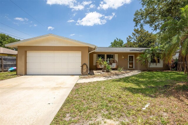 833 Lucerne Cir, Ormond Beach, FL 32174 - ranch-style home featuring stucco siding, an attached garage, and concrete driveway