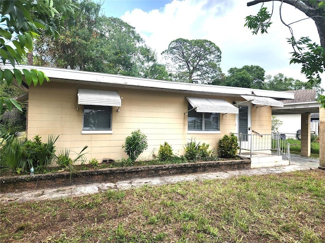 2647 Brookline Ave, New Smyrna Beach, FL 32168 - view of front facade featuring a carport