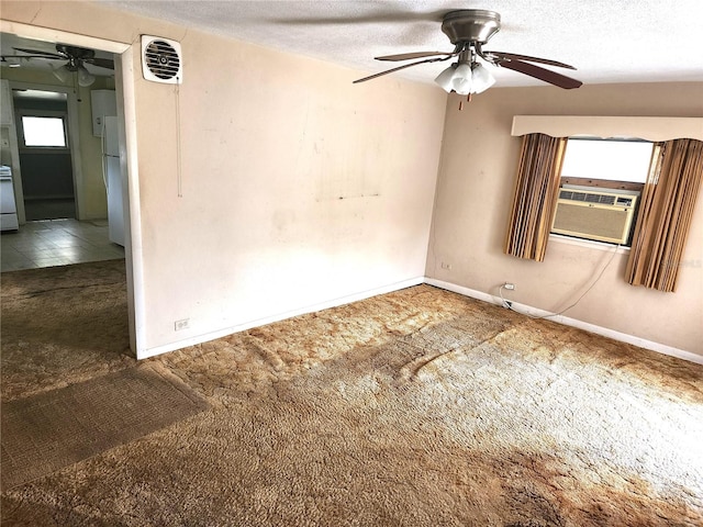 2647 Brookline Ave, New Smyrna Beach, FL 32168 - unfurnished room featuring carpet flooring, a ceiling fan, a textured ceiling, and cooling unit