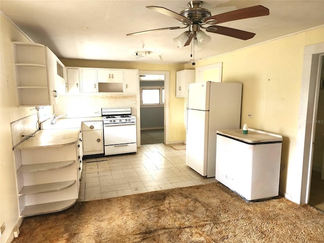 2647 Brookline Ave, New Smyrna Beach, FL 32168 - kitchen featuring open shelves, white appliances, ceiling fan, white cabinets, and light countertops