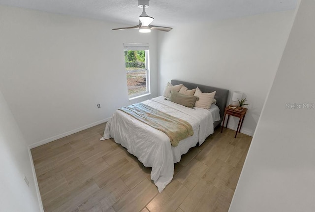 1092 Gage Ave, Deltona, FL 32738 - bedroom featuring light wood finished floors, ceiling fan, and baseboards