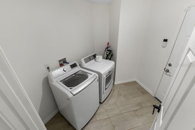 1092 Gage Ave, Deltona, FL 32738 - washroom with independent washer and dryer and baseboards