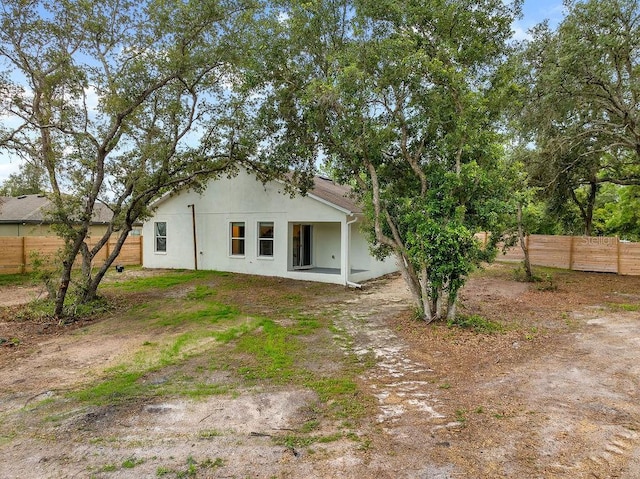 1092 Gage Ave, Deltona, FL 32738 - back of house featuring stucco siding