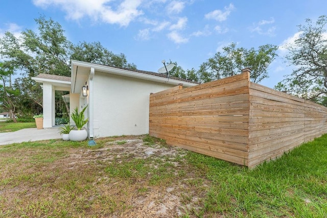 1092 Gage Ave, Deltona, FL 32738 - view of side of home featuring stucco siding