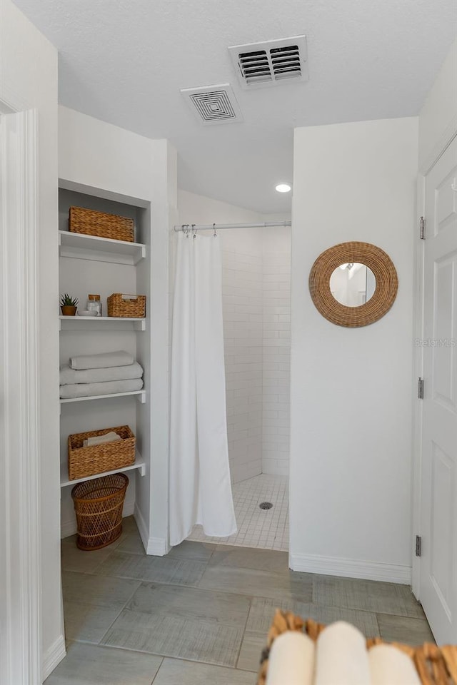 1092 Gage Ave, Deltona, FL 32738 - full bathroom featuring tiled shower, baseboards, tile patterned flooring, and recessed lighting