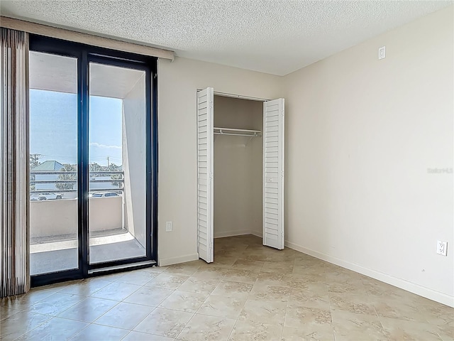 1 Oceans W Blvd Unit 2A1, Daytona Beach, FL 32118 - unfurnished bedroom featuring a closet and baseboards
