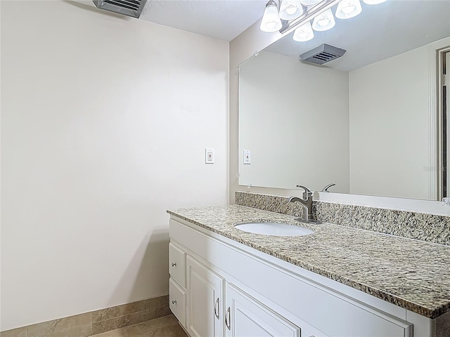 1 Oceans W Blvd Unit 2A1, Daytona Beach, FL 32118 - bathroom with vanity, tile patterned flooring, and baseboards