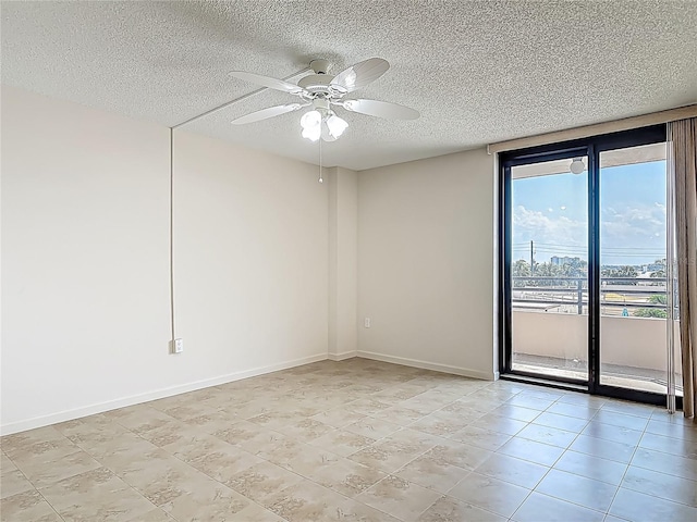 1 Oceans W Blvd Unit 2A1, Daytona Beach, FL 32118 - spare room featuring a textured ceiling, a ceiling fan, light tile patterned flooring, and baseboards