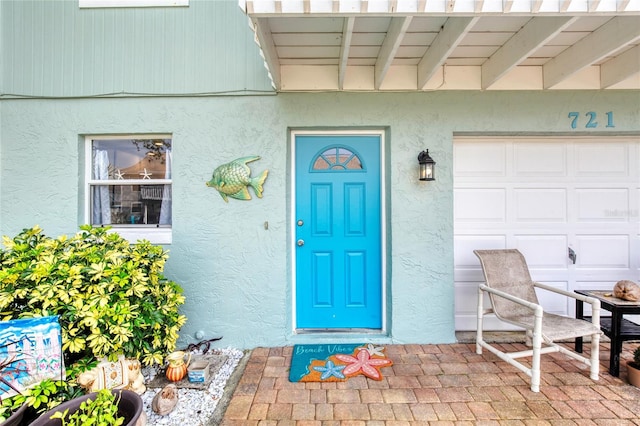 721 Laurel Bay Cir, New Smyrna Beach, FL 32169 - entrance to property featuring stucco siding and a garage