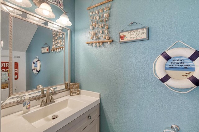 721 Laurel Bay Cir, New Smyrna Beach, FL 32169 - bathroom featuring vanity and a textured wall