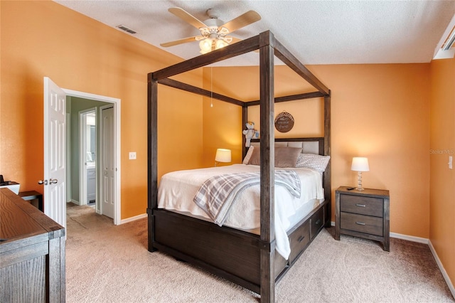 721 Laurel Bay Cir, New Smyrna Beach, FL 32169 - bedroom with light colored carpet, baseboards, a textured ceiling, and a ceiling fan
