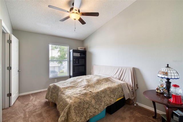 721 Laurel Bay Cir, New Smyrna Beach, FL 32169 - carpeted bedroom featuring a textured ceiling, vaulted ceiling, baseboards, and a ceiling fan