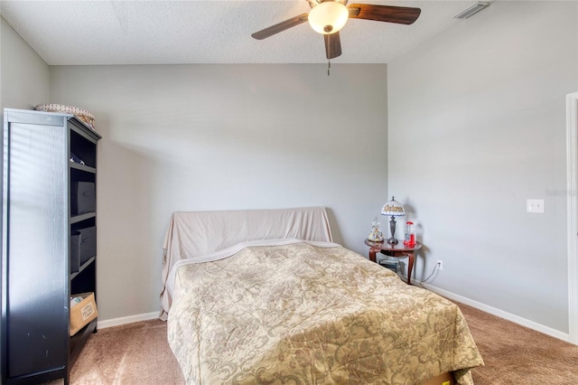 721 Laurel Bay Cir, New Smyrna Beach, FL 32169 - bedroom with carpet floors, baseboards, a ceiling fan, and a textured ceiling