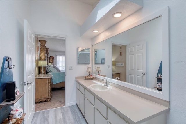 721 Laurel Bay Cir, New Smyrna Beach, FL 32169 - bathroom featuring ensuite bath, wood finished floors, vanity, recessed lighting, and baseboards
