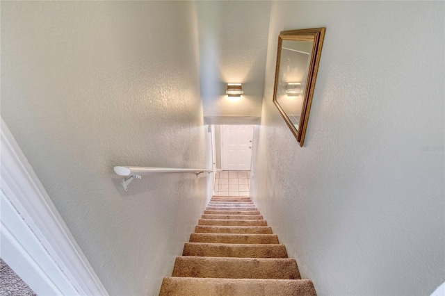 721 Laurel Bay Cir, New Smyrna Beach, FL 32169 - stairs with a textured wall