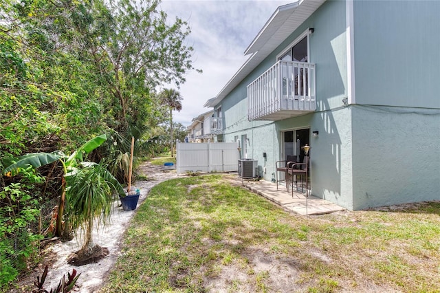 721 Laurel Bay Cir, New Smyrna Beach, FL 32169 - view of yard featuring a balcony, central AC unit, and a patio area