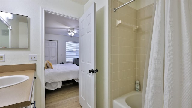 940 Village Trl Unit 8-205, Port Orange, FL 32127 - bathroom featuring vanity, ensuite bathroom, wood finished floors, shower / tub combo, and ceiling fan