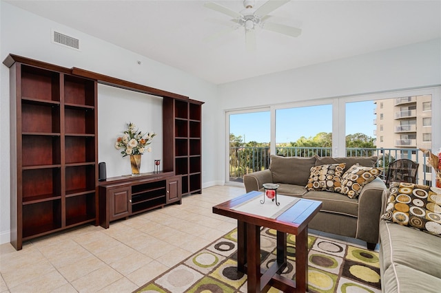 2 Oceans W Blvd Unit 305, Daytona Beach, FL 32118 - living room with a ceiling fan and light tile patterned flooring