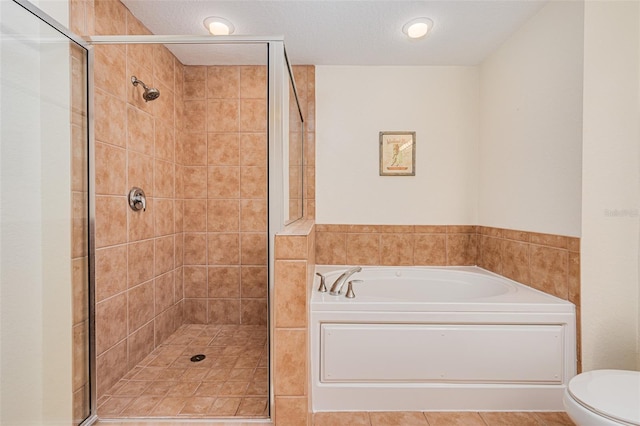2 Oceans W Blvd Unit 305, Daytona Beach, FL 32118 - bathroom with a stall shower and a garden tub