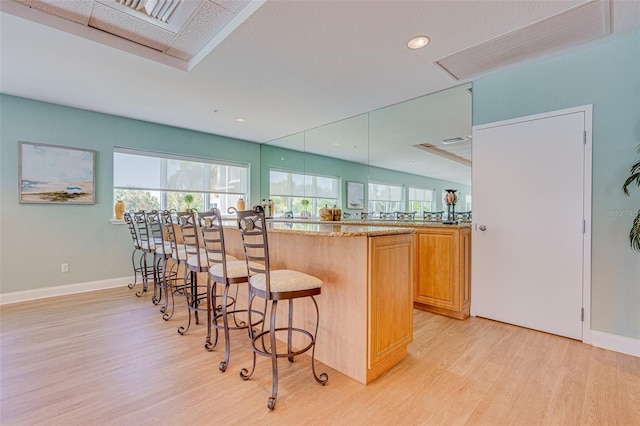 2 Oceans W Blvd Unit 305, Daytona Beach, FL 32118 - bar featuring light wood finished floors, healthy amount of natural light, and recessed lighting