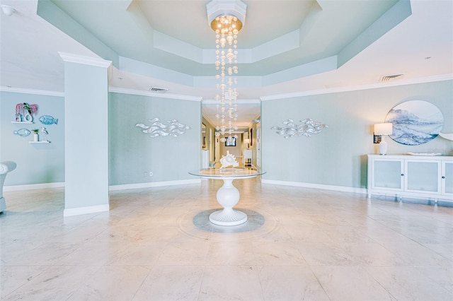 2 Oceans W Blvd Unit 305, Daytona Beach, FL 32118 - hall featuring a chandelier, ornamental molding, and a tray ceiling