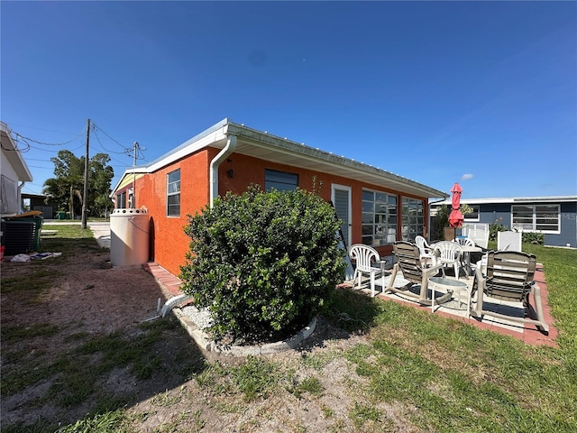 29146 Tamayo Dr, Punta Gorda, FL 33982 - back of house featuring a patio area
