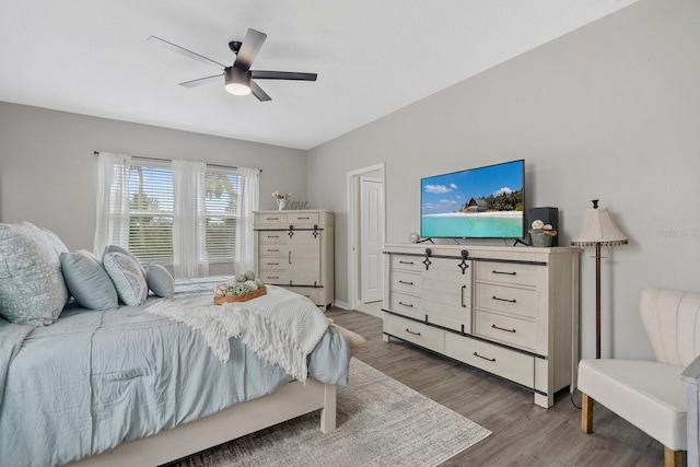 7114 Mill Hopper Ct, Palmetto, FL 34221 - bedroom featuring wood finished floors and ceiling fan