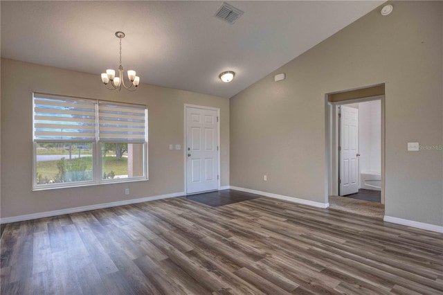 6 Laurel Pass Ct, Ocala, FL 34480 - spare room featuring a chandelier, dark wood-type flooring, vaulted ceiling, baseboards, and a smoke detector