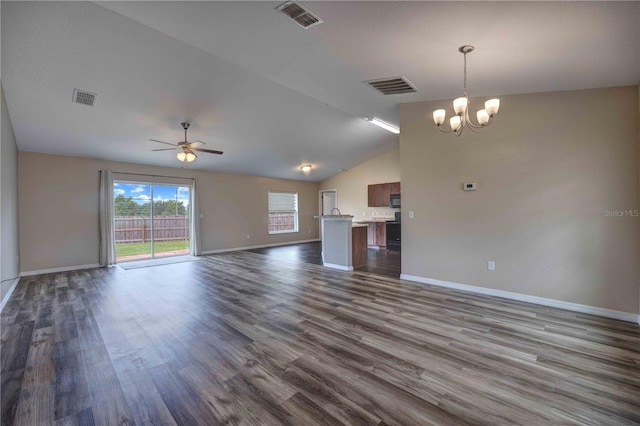 6 Laurel Pass Ct, Ocala, FL 34480 - unfurnished living room featuring baseboards, a chandelier, dark wood-style flooring, and vaulted ceiling