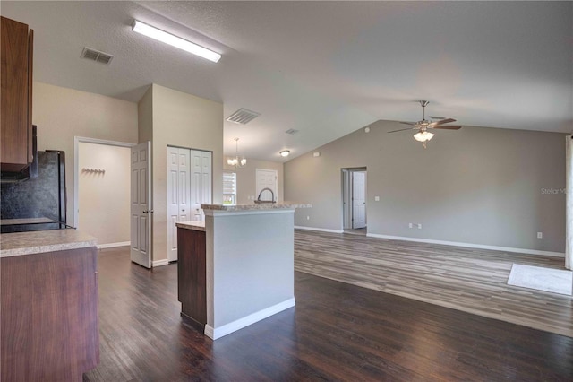 6 Laurel Pass Ct, Ocala, FL 34480 - kitchen with light countertops, freestanding refrigerator, a ceiling fan, dark wood finished floors, and vaulted ceiling