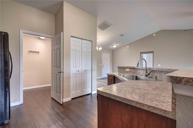 6 Laurel Pass Ct, Ocala, FL 34480 - kitchen with a sink, freestanding refrigerator, lofted ceiling, dark wood-style floors, and baseboards