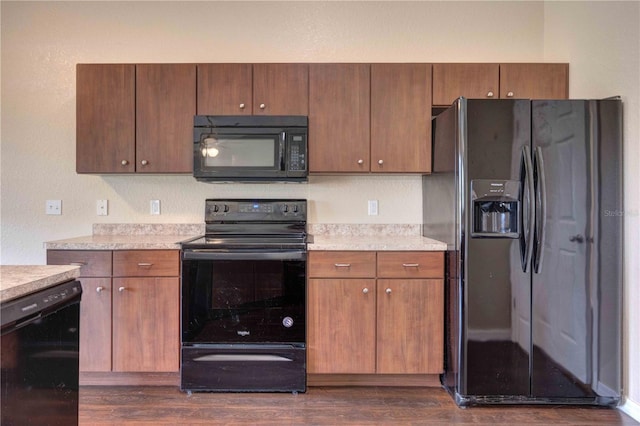 6 Laurel Pass Ct, Ocala, FL 34480 - kitchen with black appliances, light countertops, and dark wood-style floors