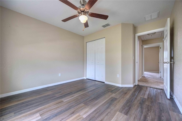 6 Laurel Pass Ct, Ocala, FL 34480 - unfurnished bedroom with attic access, dark wood finished floors, baseboards, a closet, and ceiling fan