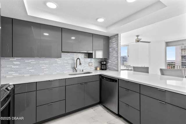 3047 S Atlantic Ave Unit 1805, Daytona Beach, FL 32118 - kitchen featuring dishwasher, gray cabinets, a sink, range, and a raised ceiling