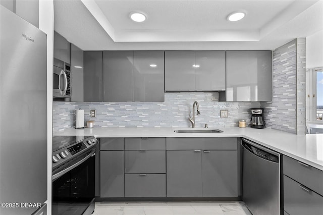 3047 S Atlantic Ave Unit 1805, Daytona Beach, FL 32118 - kitchen featuring gray cabinets, appliances with stainless steel finishes, a sink, and modern cabinets