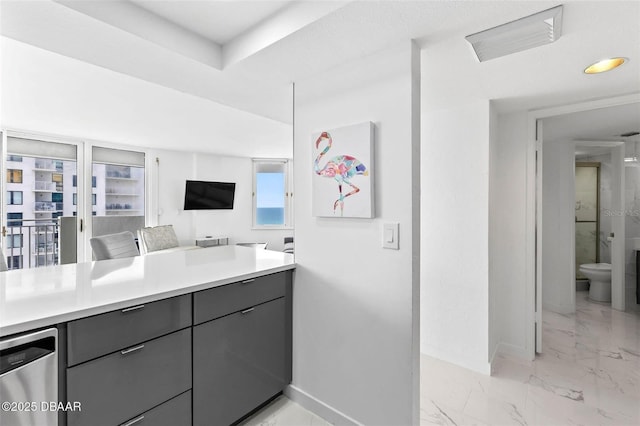 3047 S Atlantic Ave Unit 1805, Daytona Beach, FL 32118 - full bath featuring baseboards, toilet, vanity, and marble look tiles