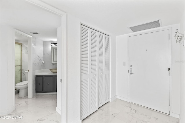 3047 S Atlantic Ave Unit 1805, Daytona Beach, FL 32118 - foyer featuring marble finish floors
