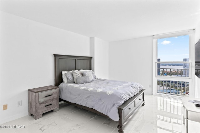 3047 S Atlantic Ave Unit 1805, Daytona Beach, FL 32118 - bedroom with light marble finish flooring and baseboards