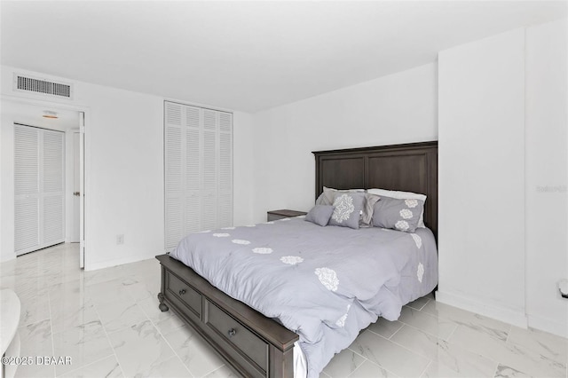 3047 S Atlantic Ave Unit 1805, Daytona Beach, FL 32118 - bedroom featuring light marble finish floors, baseboards, and a closet