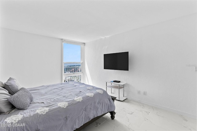 3047 S Atlantic Ave Unit 1805, Daytona Beach, FL 32118 - bedroom featuring marble finish floors and baseboards
