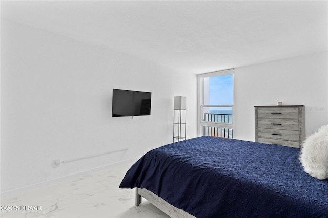 3047 S Atlantic Ave Unit 1805, Daytona Beach, FL 32118 - bedroom with marble finish flooring and baseboards