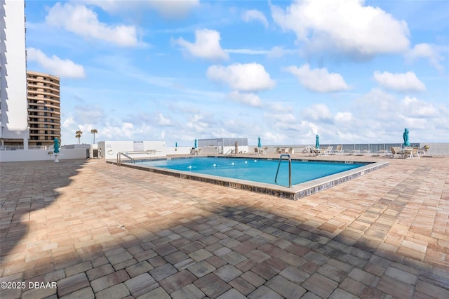 3047 S Atlantic Ave Unit 1805, Daytona Beach, FL 32118 - community pool featuring a patio